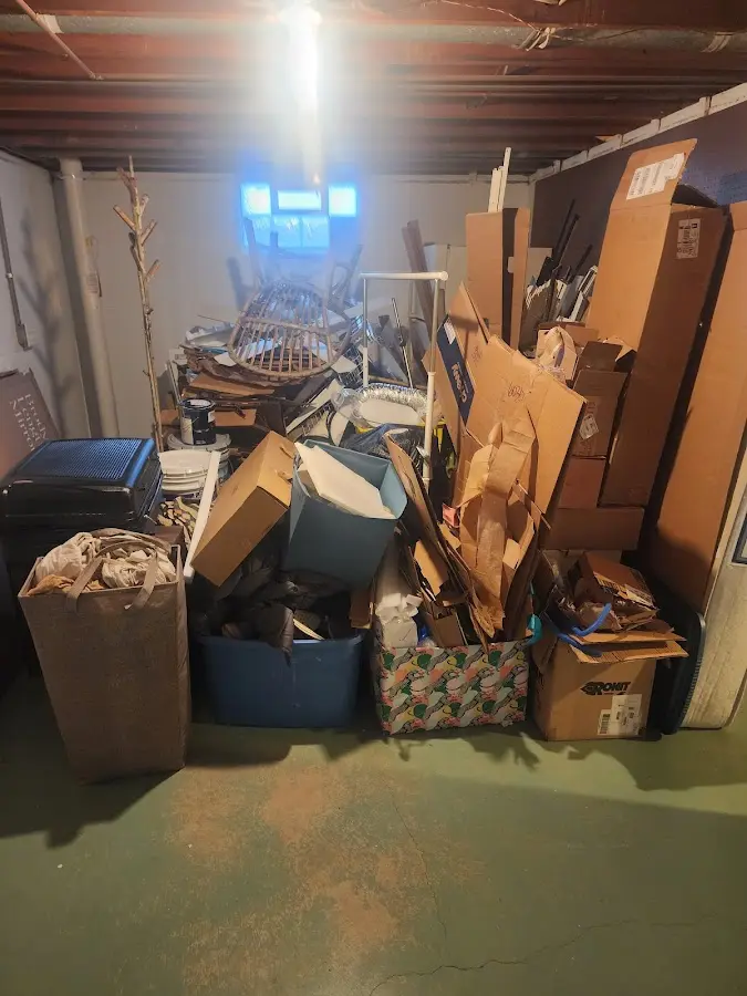 Roll-off dumpster container at job site for Construction Dumpster Rental in Wellesley